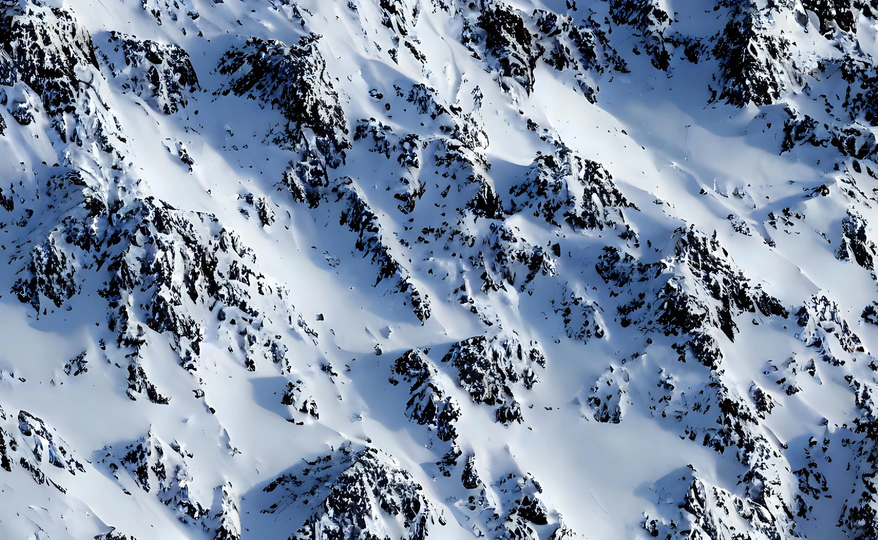 an aerial view of a large pile of snow on mountains