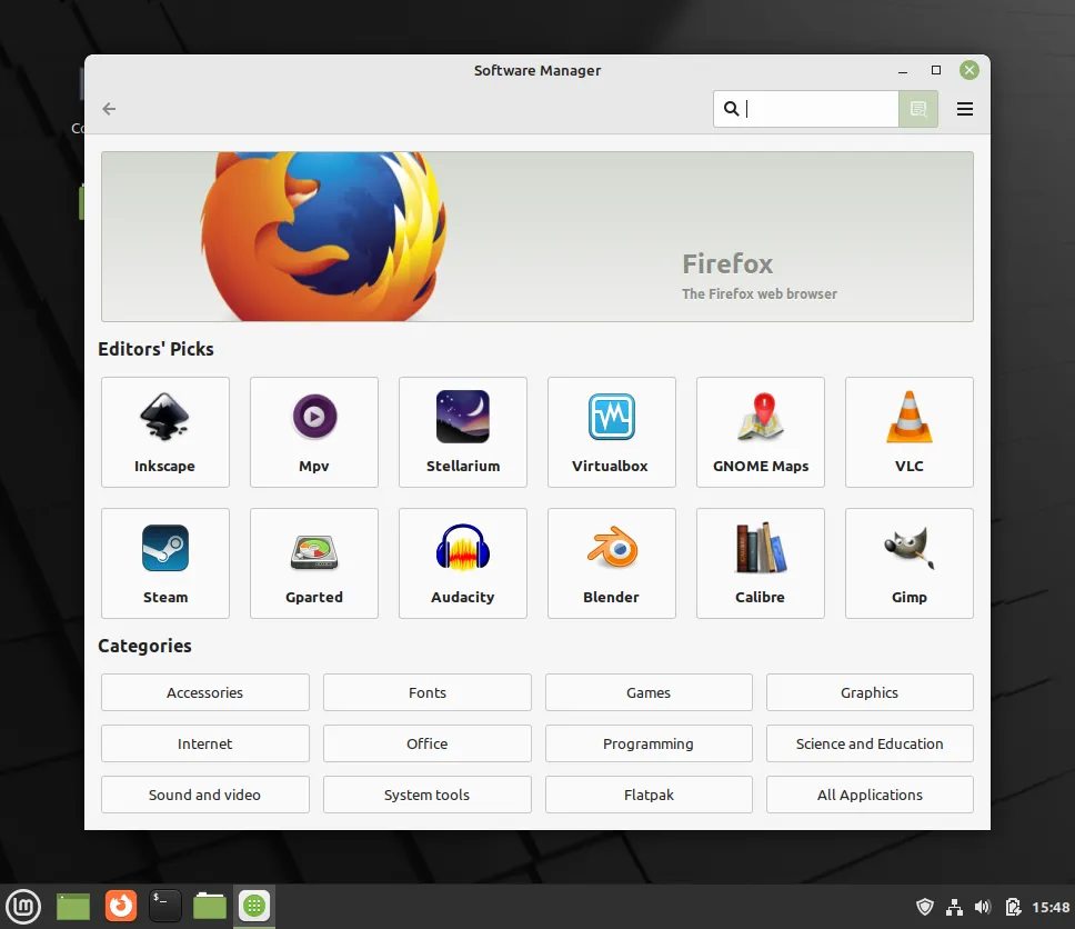 A view of a computer's desktop, with the app “Software Manager” displayed in the center. The app window contains a banner for the featured “Firefox” app, as well as a grid of different app icons. At the bottom of the window is another grid of app categories.