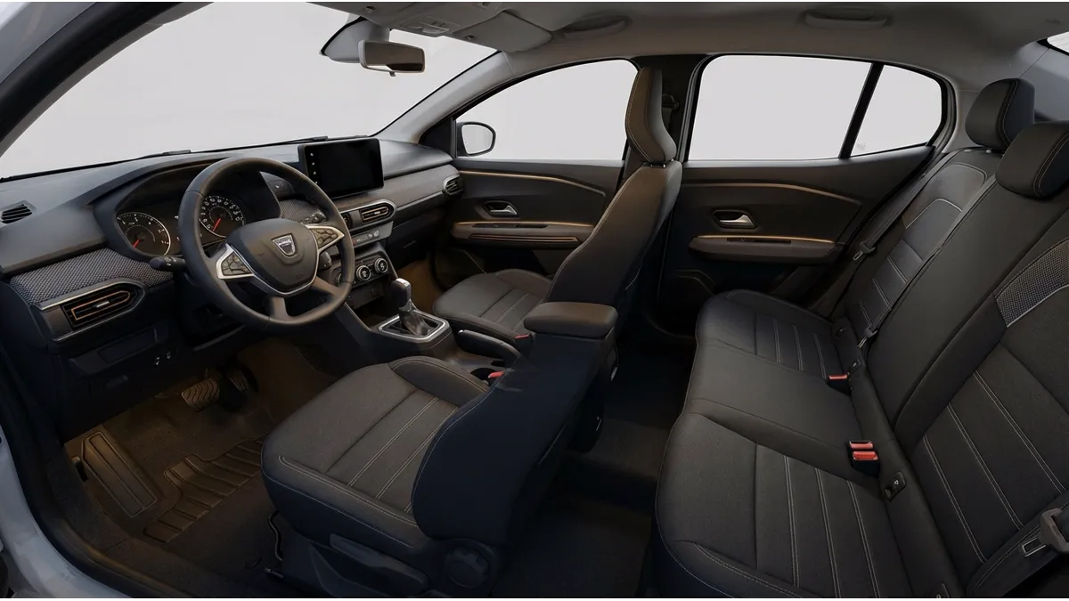 Vue de l'habitacle avant d'une Dacia Logan 2024 avec sièges ergonomiques, ceintures de sécurité et airbags, soulignant le confort et la sécurité de la Dacia Logan