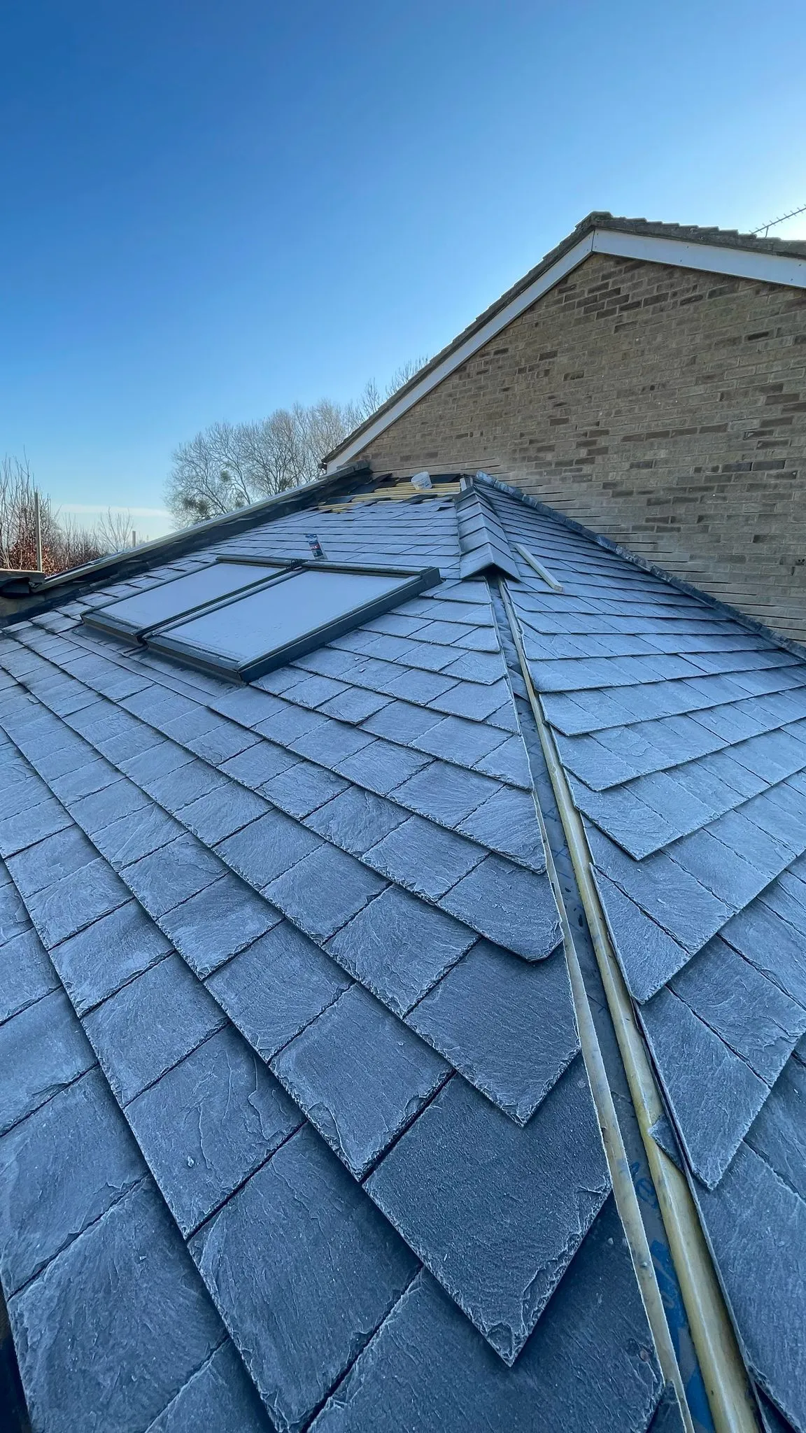 New slate roof with Velux windows installed by DP Carpentry & Building LTD in Gloucestershire