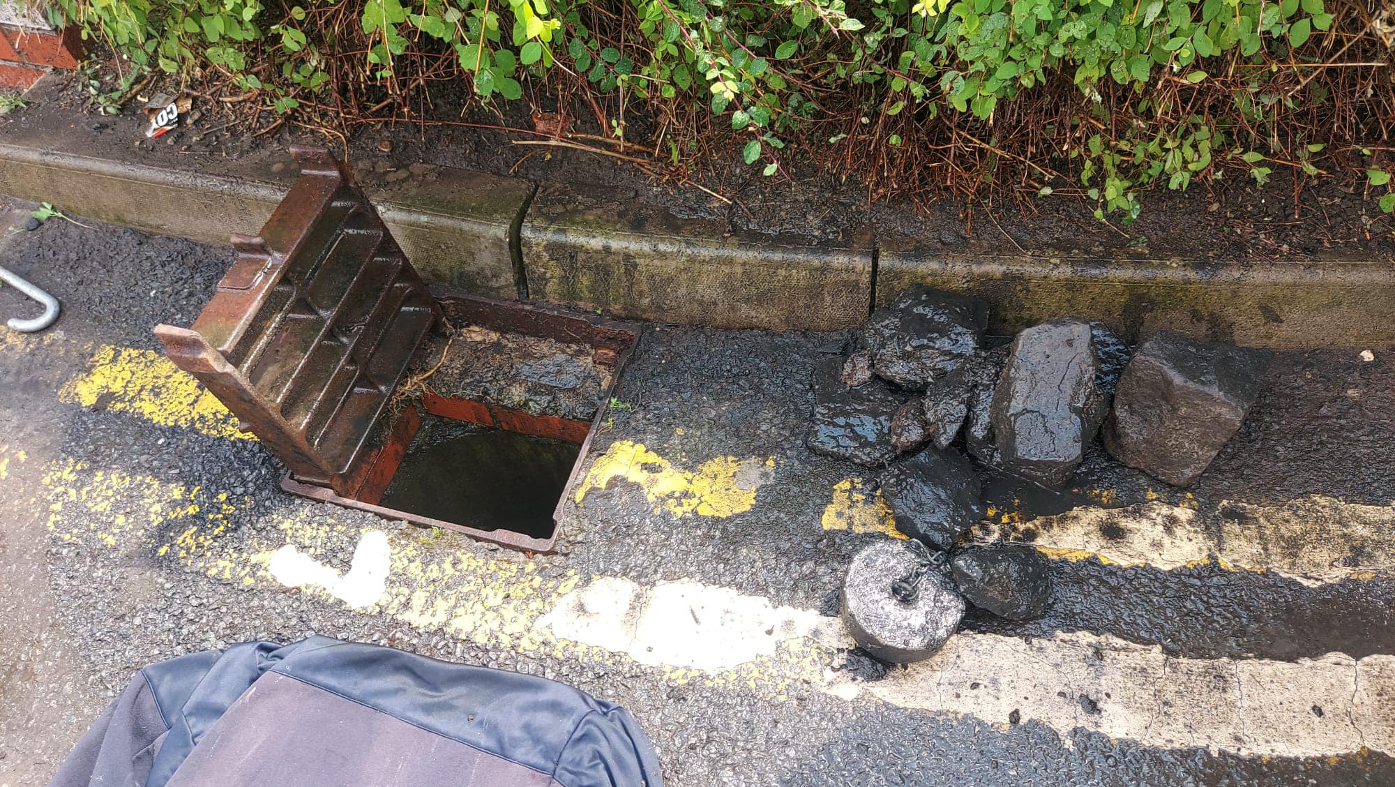 Drain 2 Flow Exmouth clearing a blocked street gully, showing removed debris from a drain unblocking job.