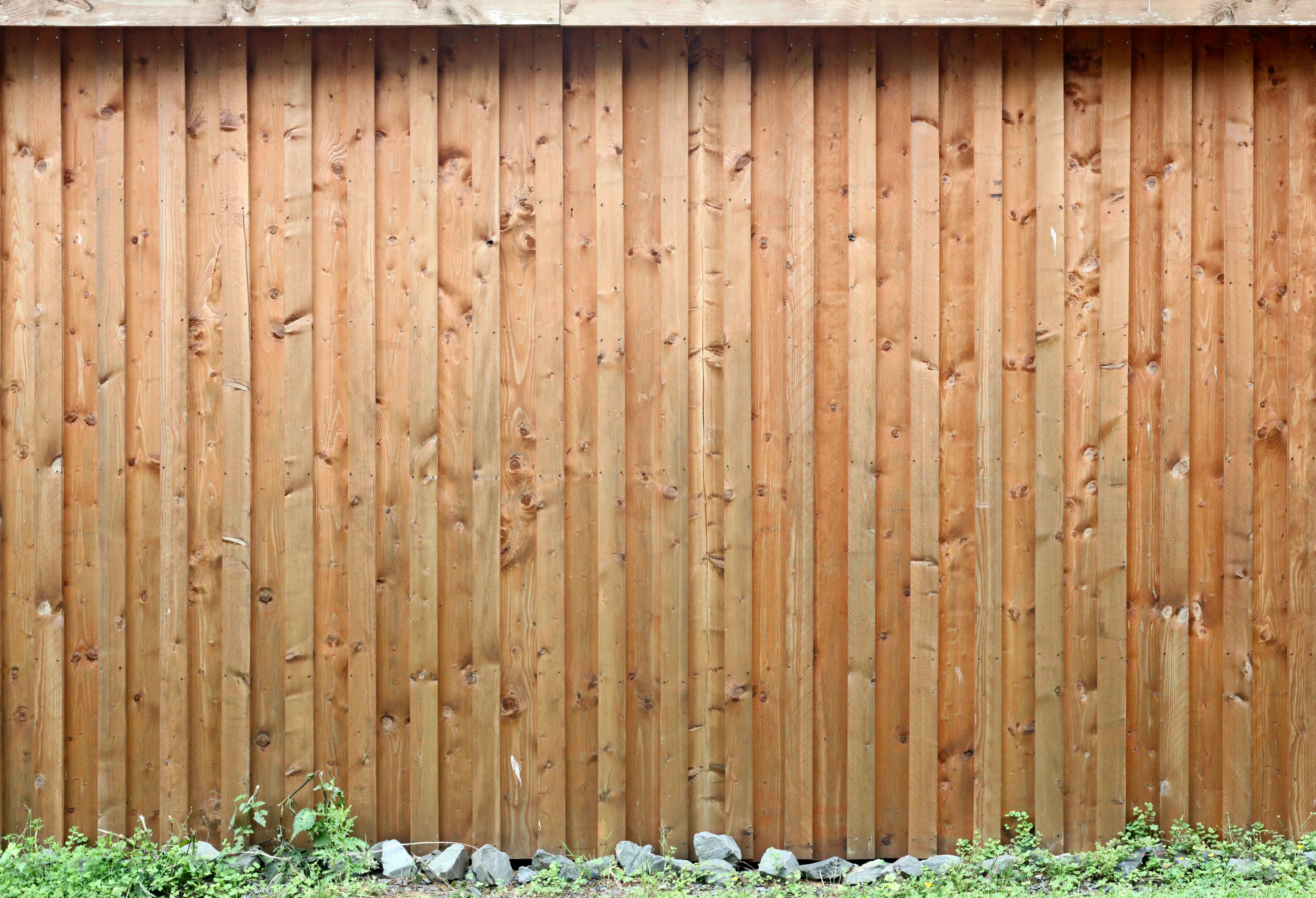 Close-up of new wooden fence planks.