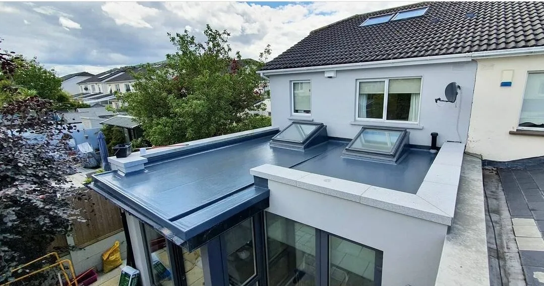 Newly installed flat roof with rooflights on a house extension