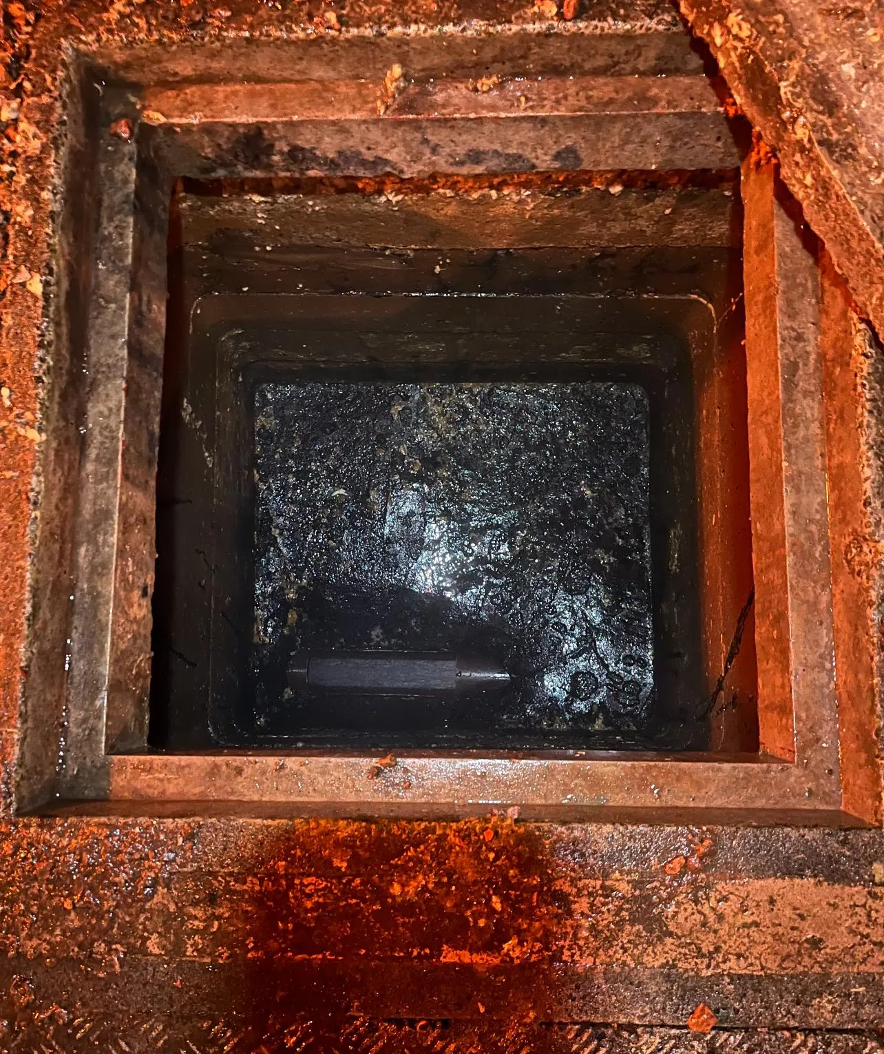 View looking down into a blocked drain