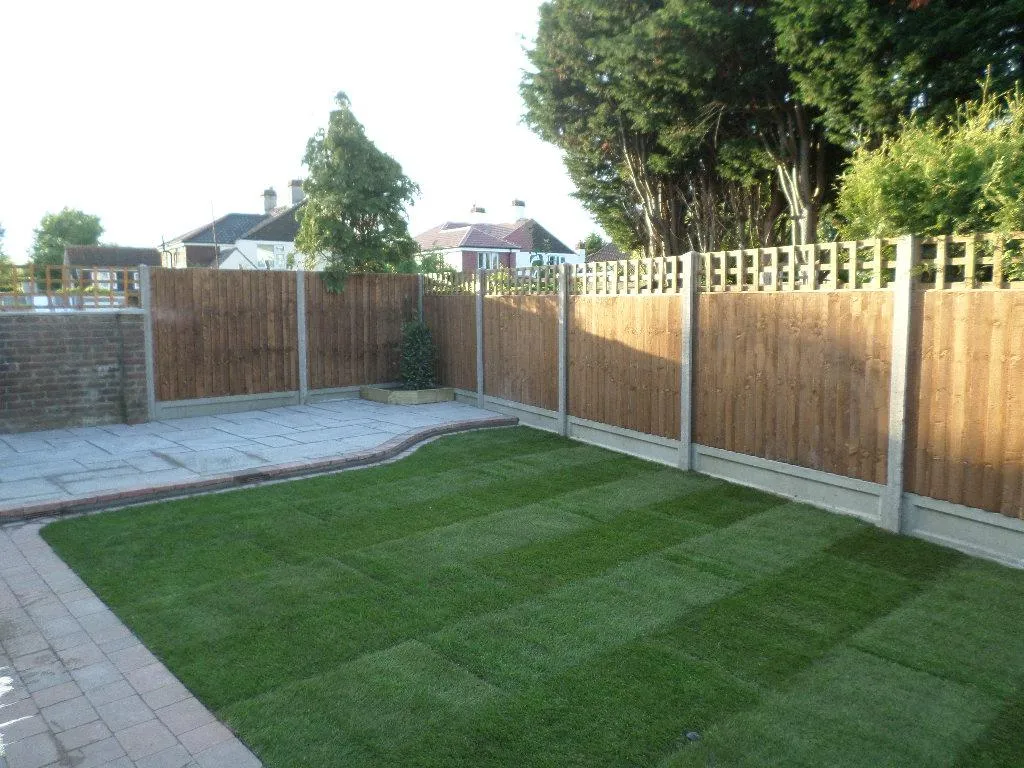 Newly completed garden makeover with new fence, turf, and patio