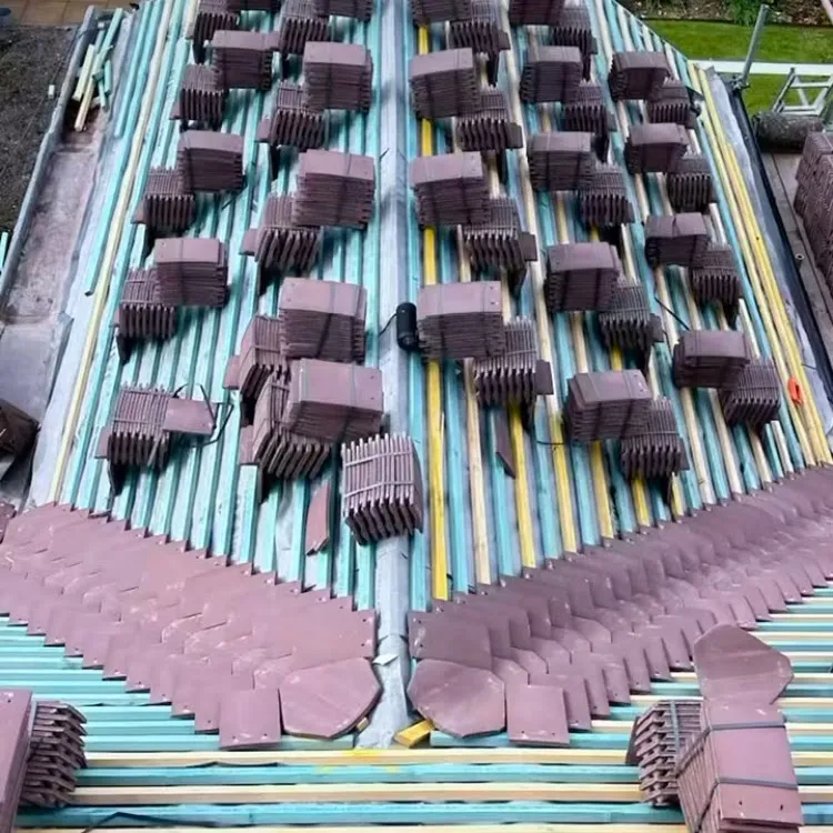 New roof installation in progress showing battens and stacks of roof tiles