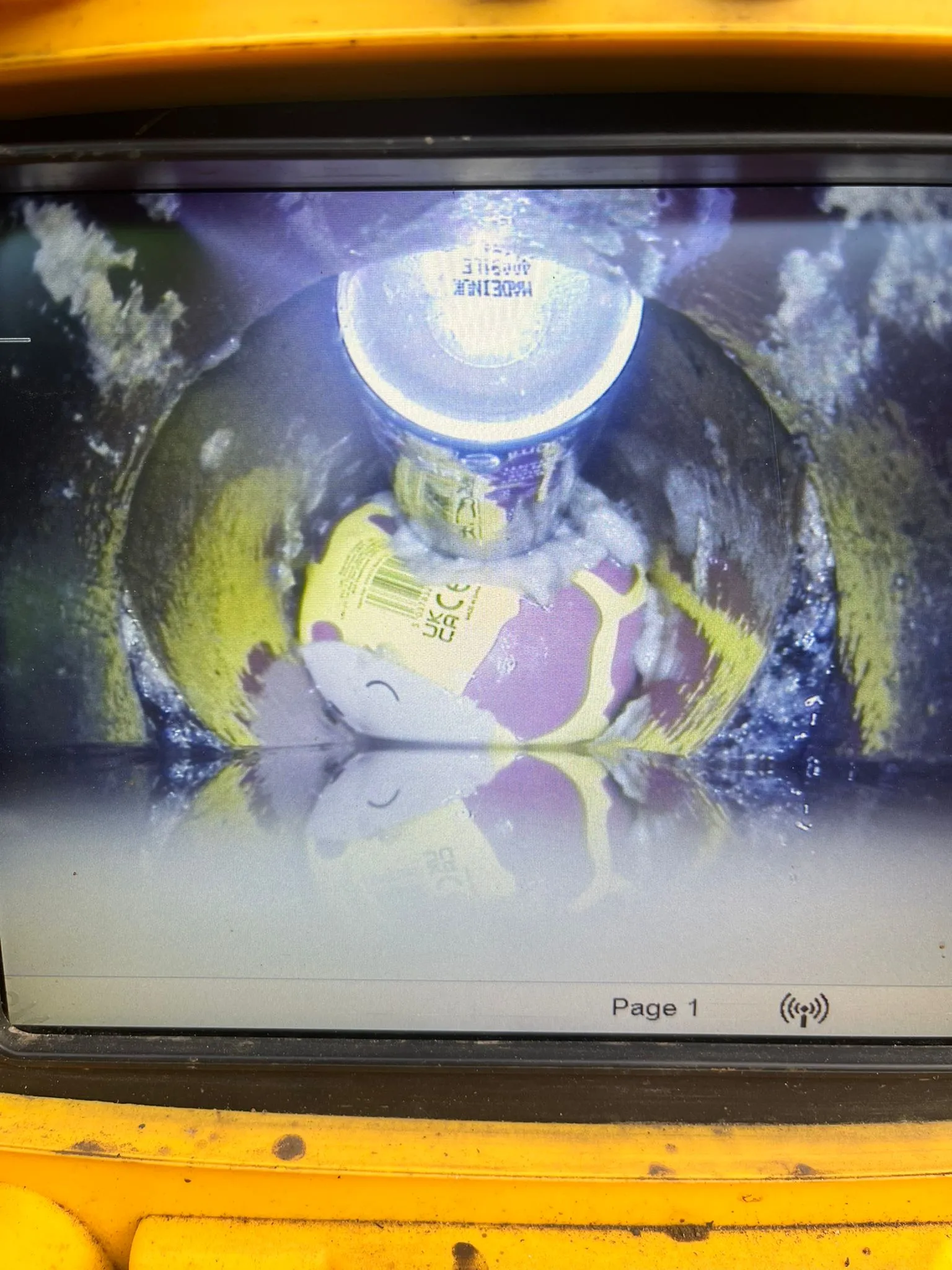 CCTV drain camera view showing a soft toy blocking a pipe