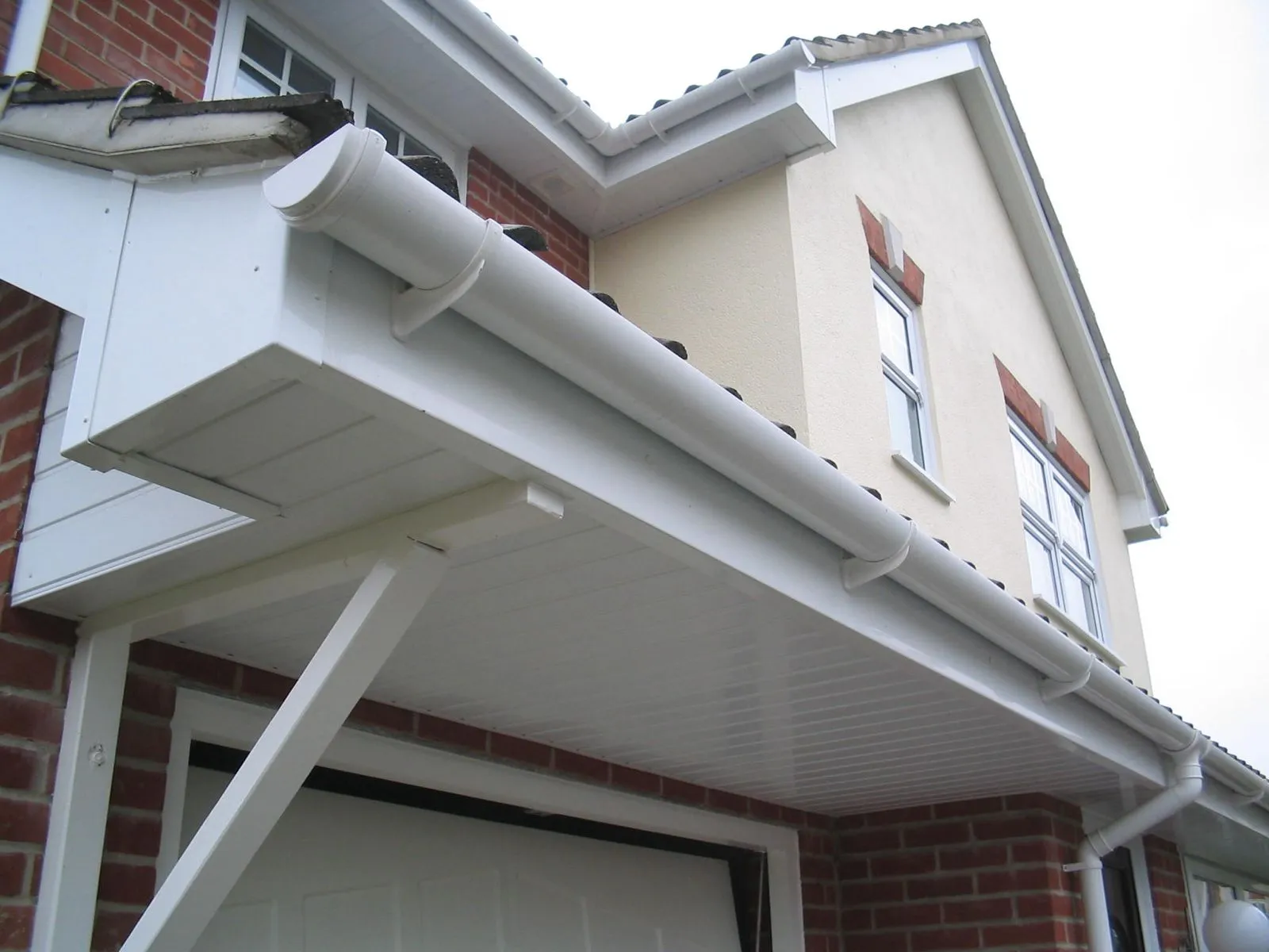 Newly fitted white guttering, fascias, and soffits on a house in Haywards Heath.