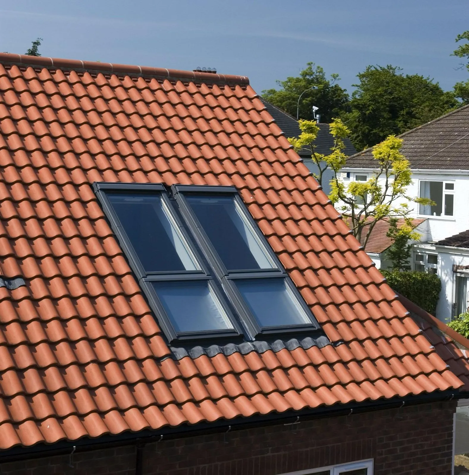 Red tiled roof with four roof windows
