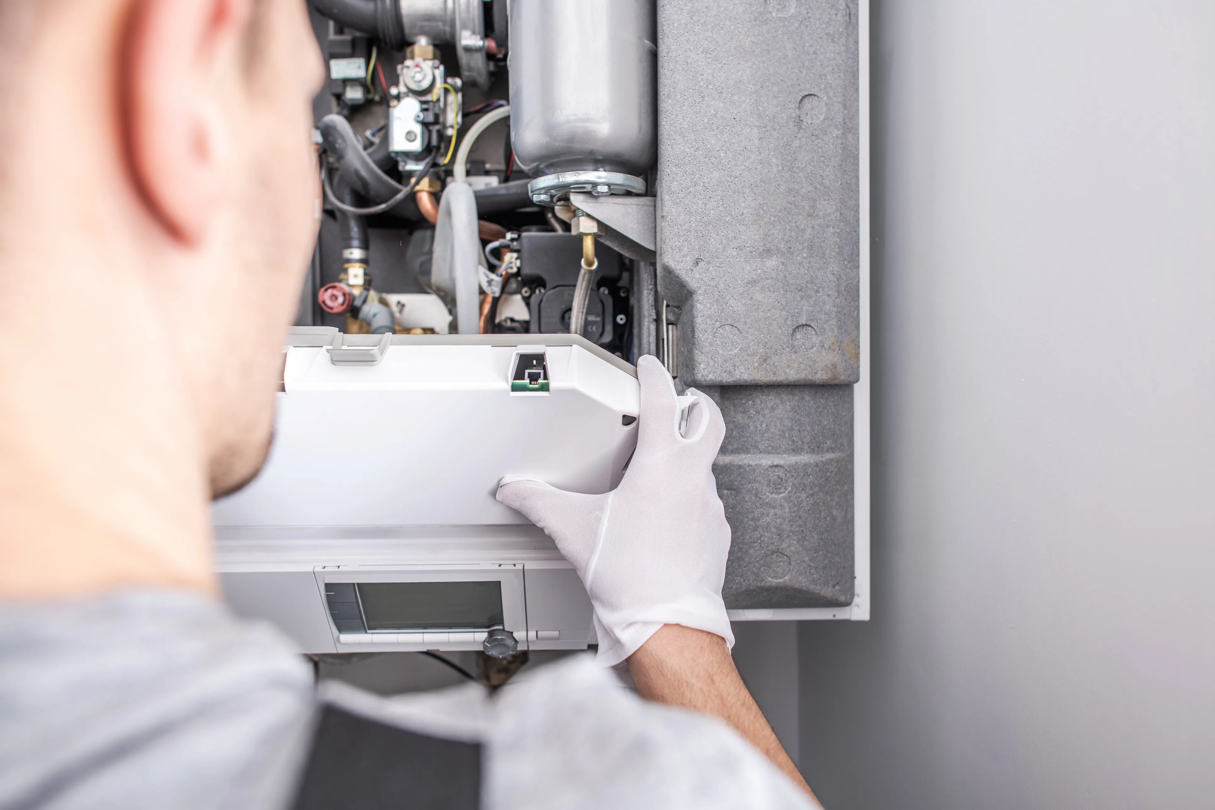 Gas Safe engineer working on a boiler in a North East home