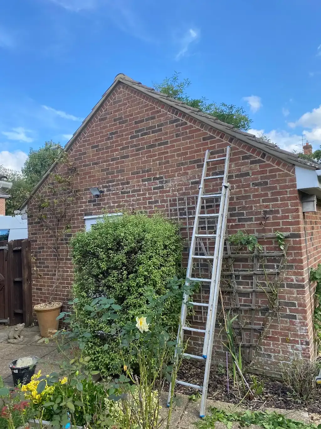 A ladder leaning against the side of a domestic property with a pitched roof, suggesting roof inspection or repairs in the Southampton area.