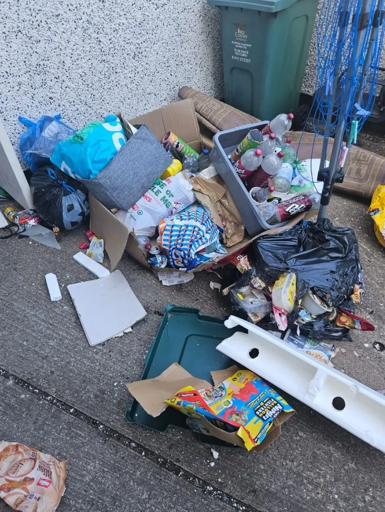 A large and messy pile of general household rubbish and waste materials, showcasing a typical scene requiring professional rubbish removal or house clearance services.