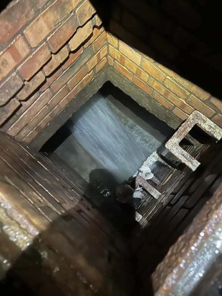 Inside of a brick drainage manhole or inspection chamber.