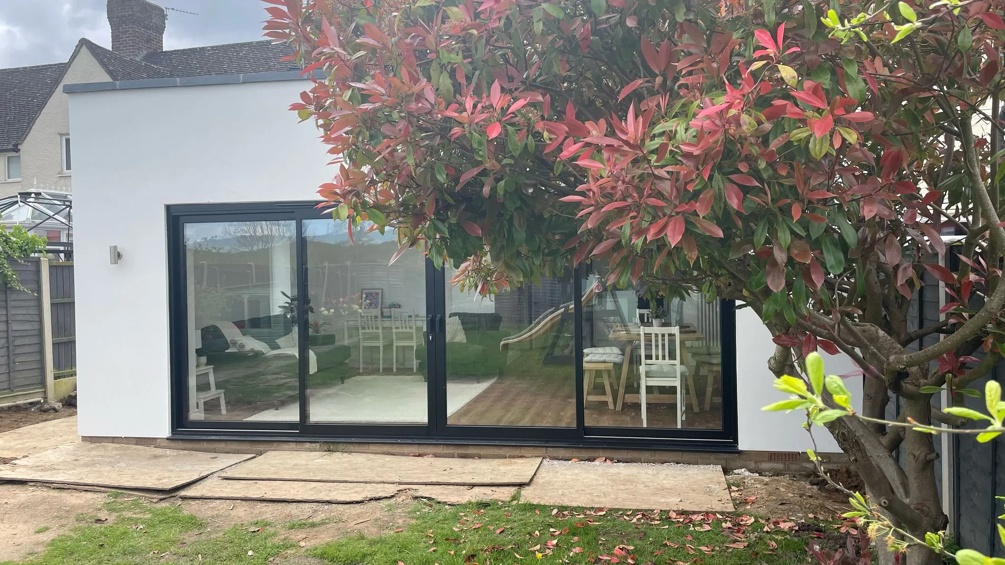 Modern home extension with large black sliding doors in Cheltenham