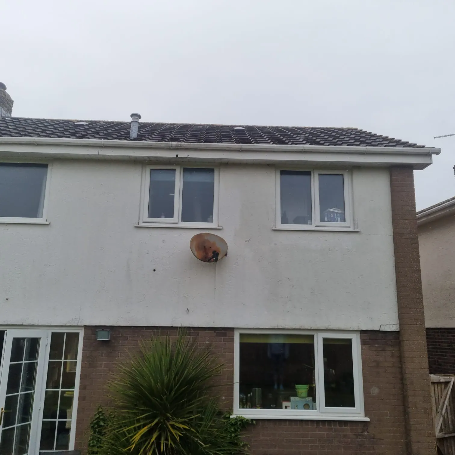 White uPVC fascias, soffits, and gutters on a residential house.