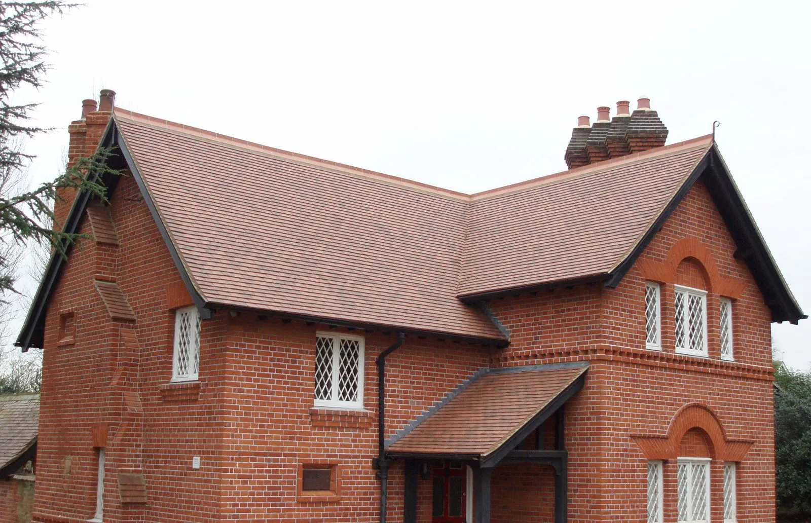 Tiled roof and brick chimneys on a house