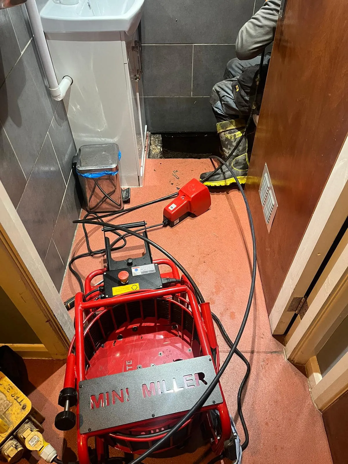 Professional drainage equipment for clearing blocked drains indoors