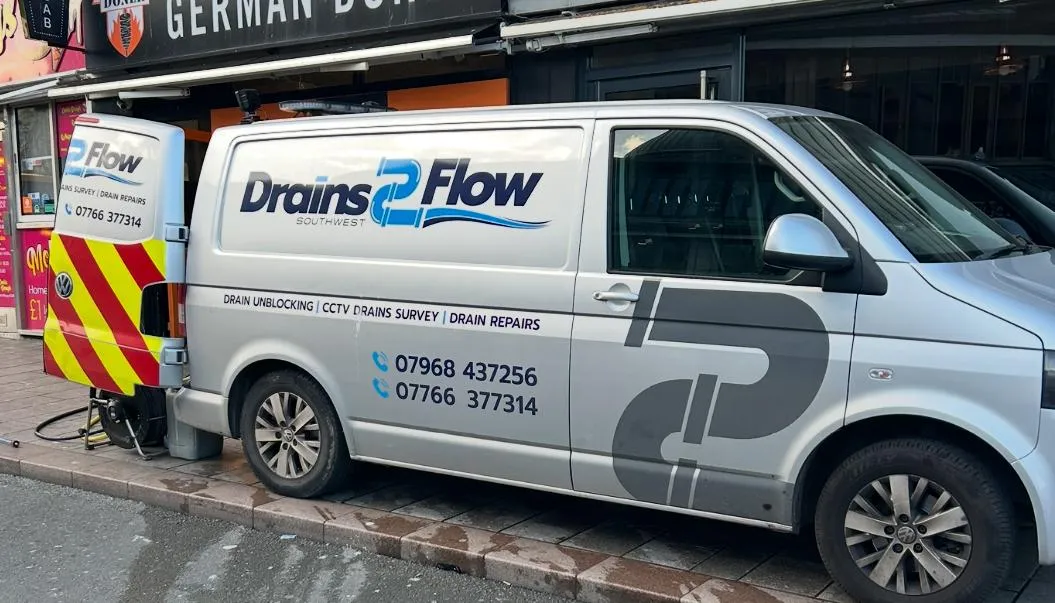 Drain 2 Flow Torquay branded service van parked on a street, showcasing local drainage services for homes and businesses.