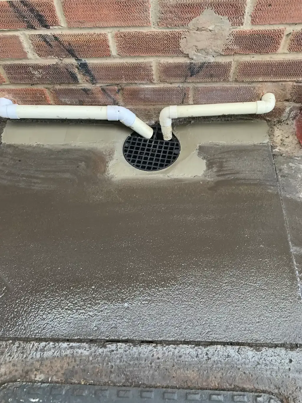 External gully drain repair with new concrete surround and waste pipes in Durham.