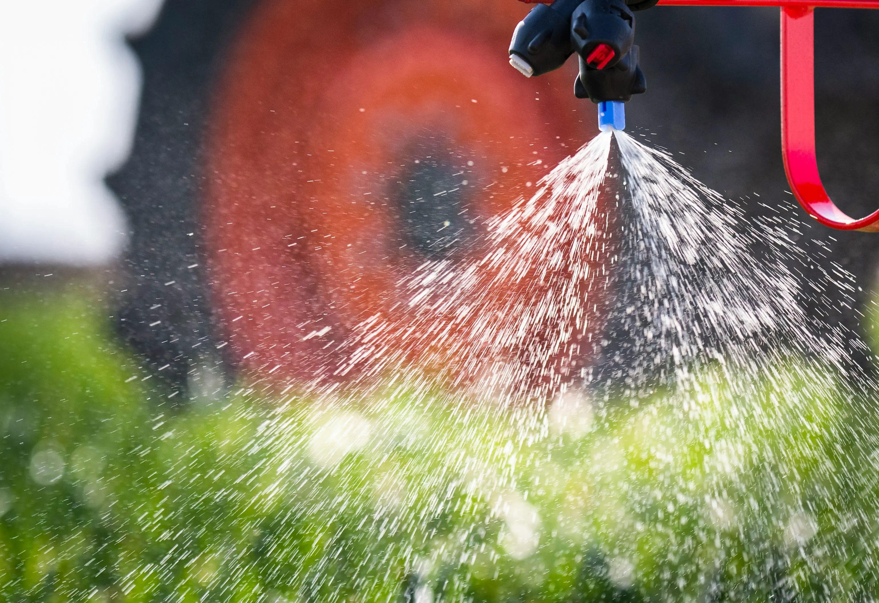 Close-up of a professional spray nozzle applying pest control treatment.