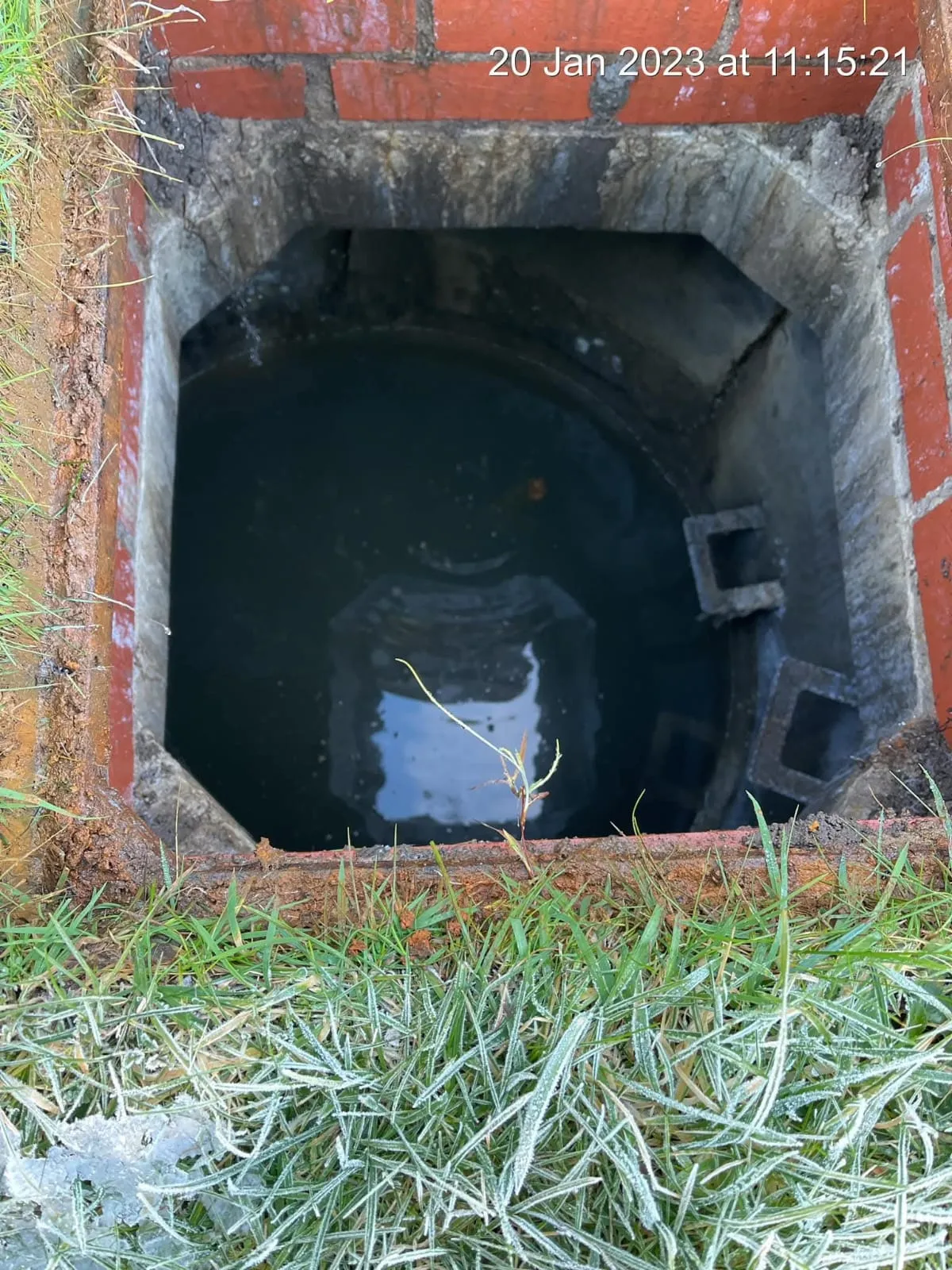 Blocked drain or manhole with standing water