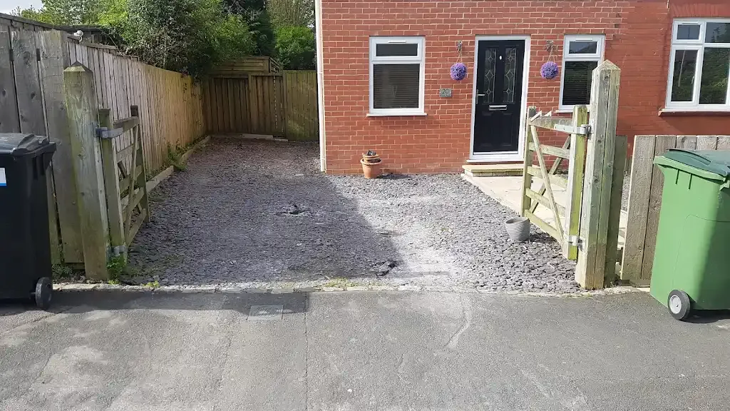 Gravel area in front of house before driveway paving