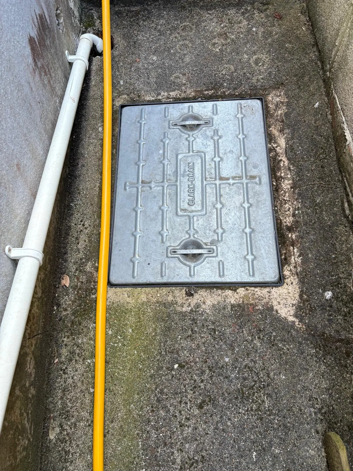 Outdoor metal drain access cover