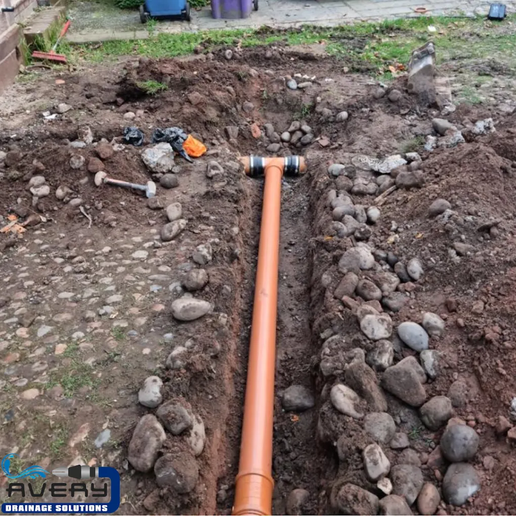 Installation of a new drainage pipe during groundworks