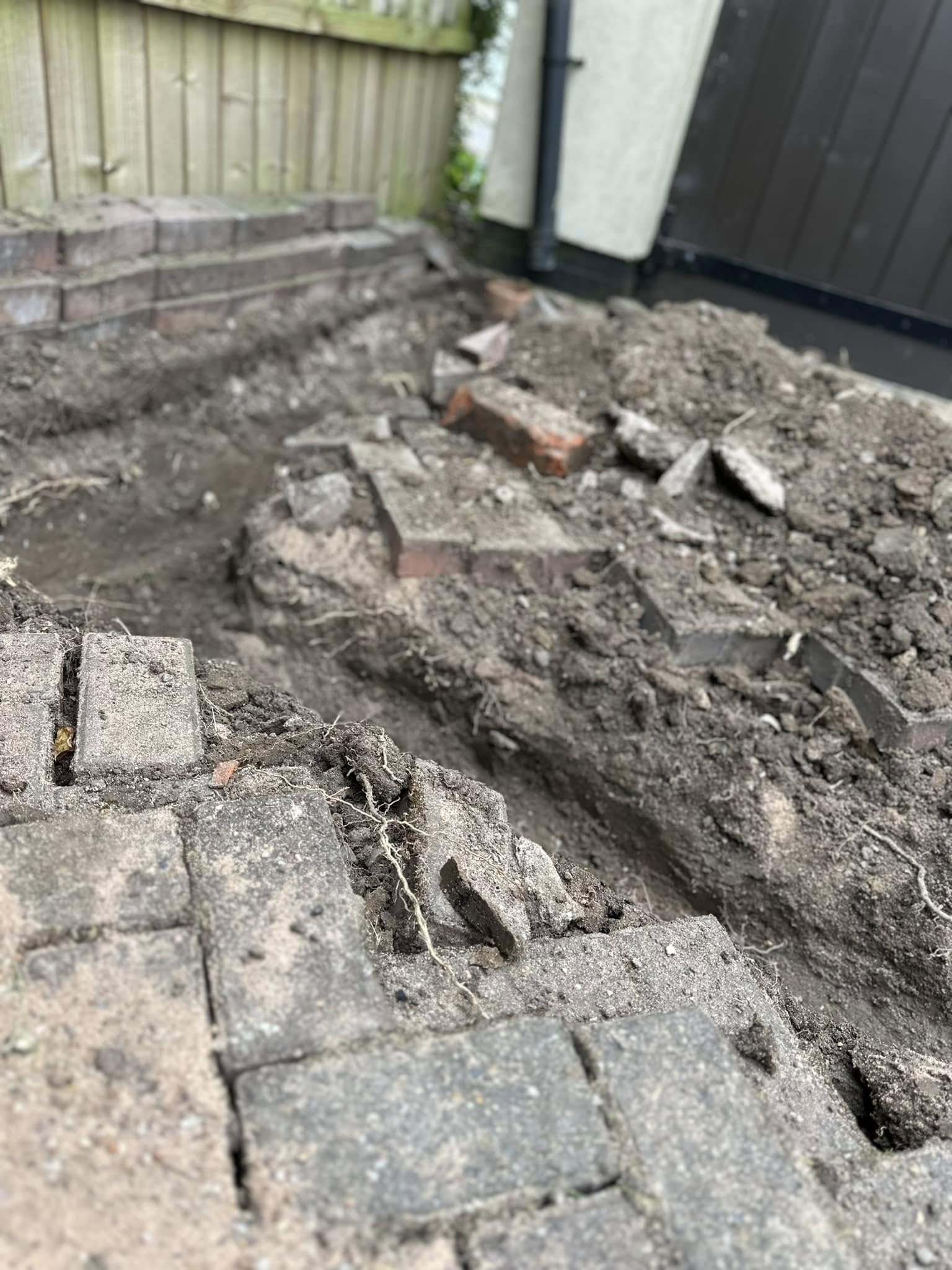 Groundwork in progress for drain repair or new drainage pipe installation by Drain 2 Flow Exeter.
