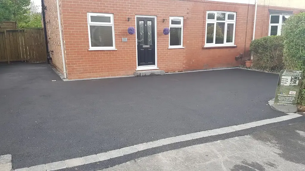 Newly laid tarmac driveway in front of a house by Insight PS