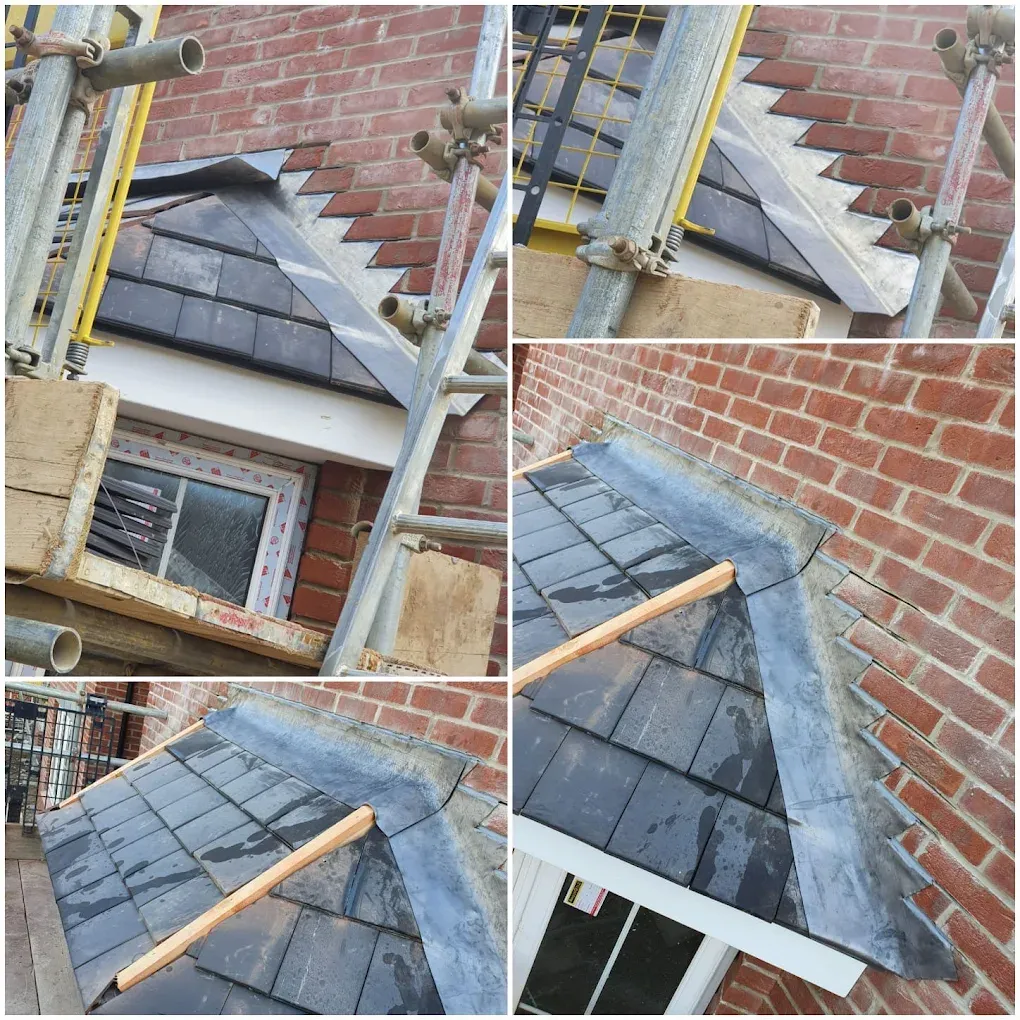 Installation of slate roof tiles and lead flashing around a dormer or window detail.