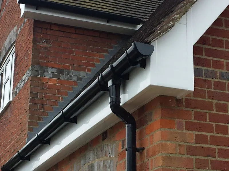 New black guttering and white fascia on a residential property