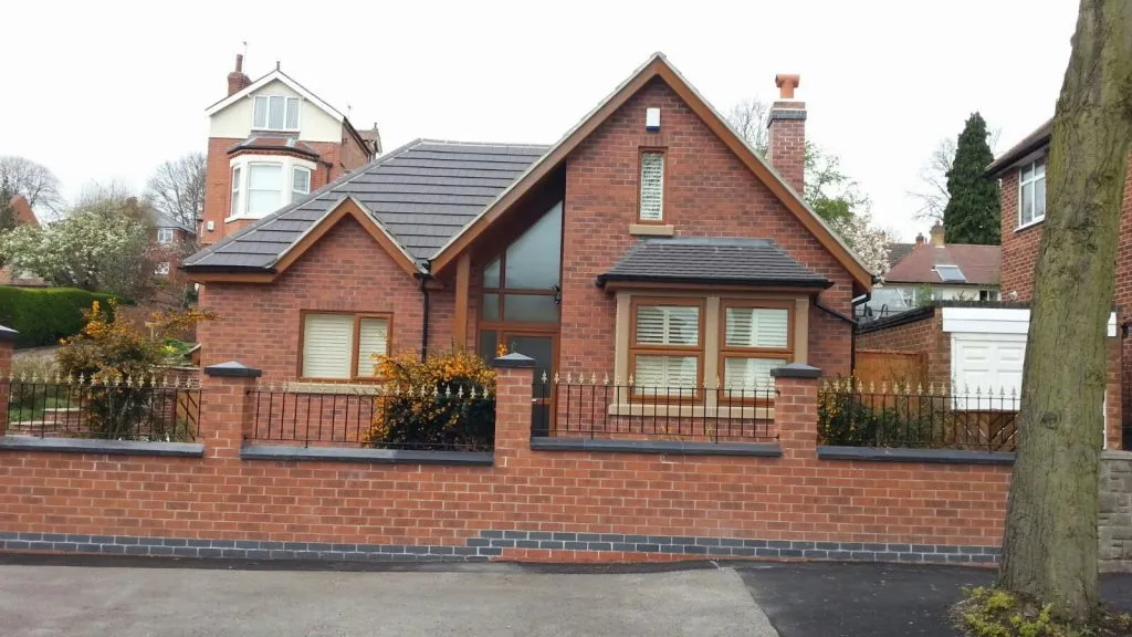 Modern brick house with a new pitched roof installation by Bridgeford Roofing Services in Nottingham.
