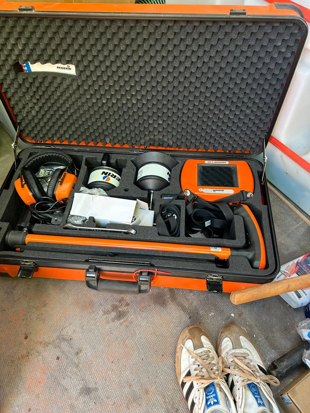 Professional acoustic leak detection equipment in a case for drainage surveys