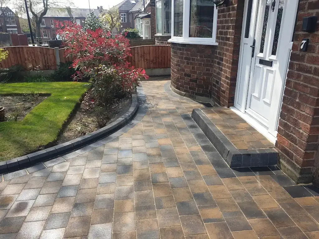 Newly laid block paving pathway and garden area