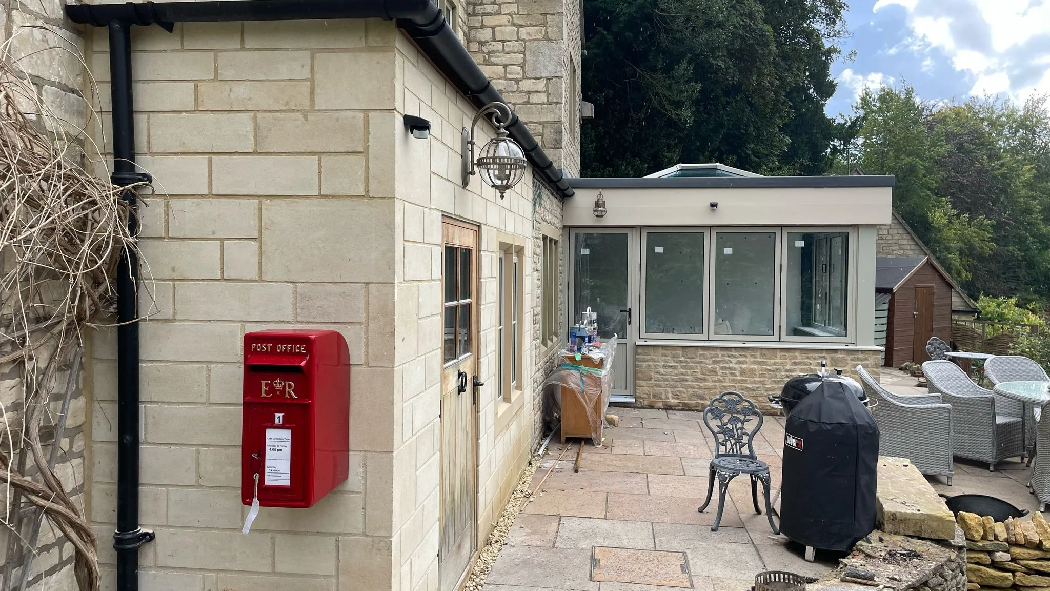 Orangery extension with bi-fold doors built onto stone house in Cheltenham, Gloucestershire by DP Carpentry & Building LTD