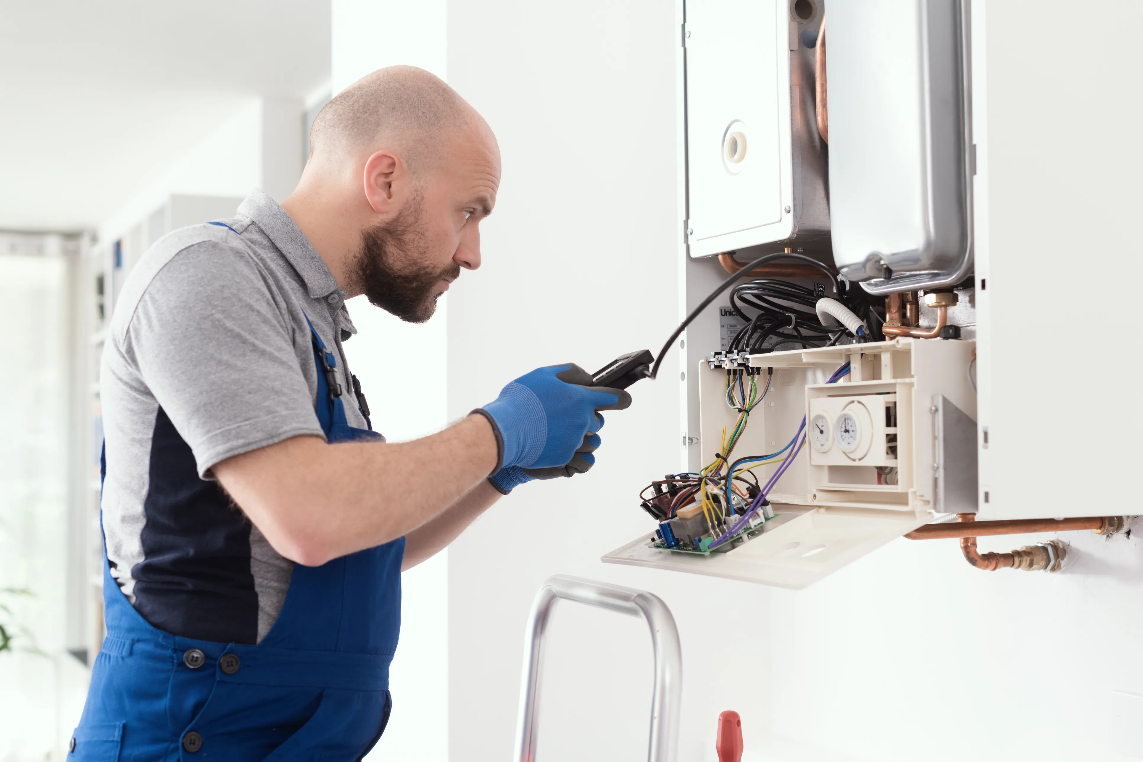 Gas Safe engineer working on a boiler in a North East home