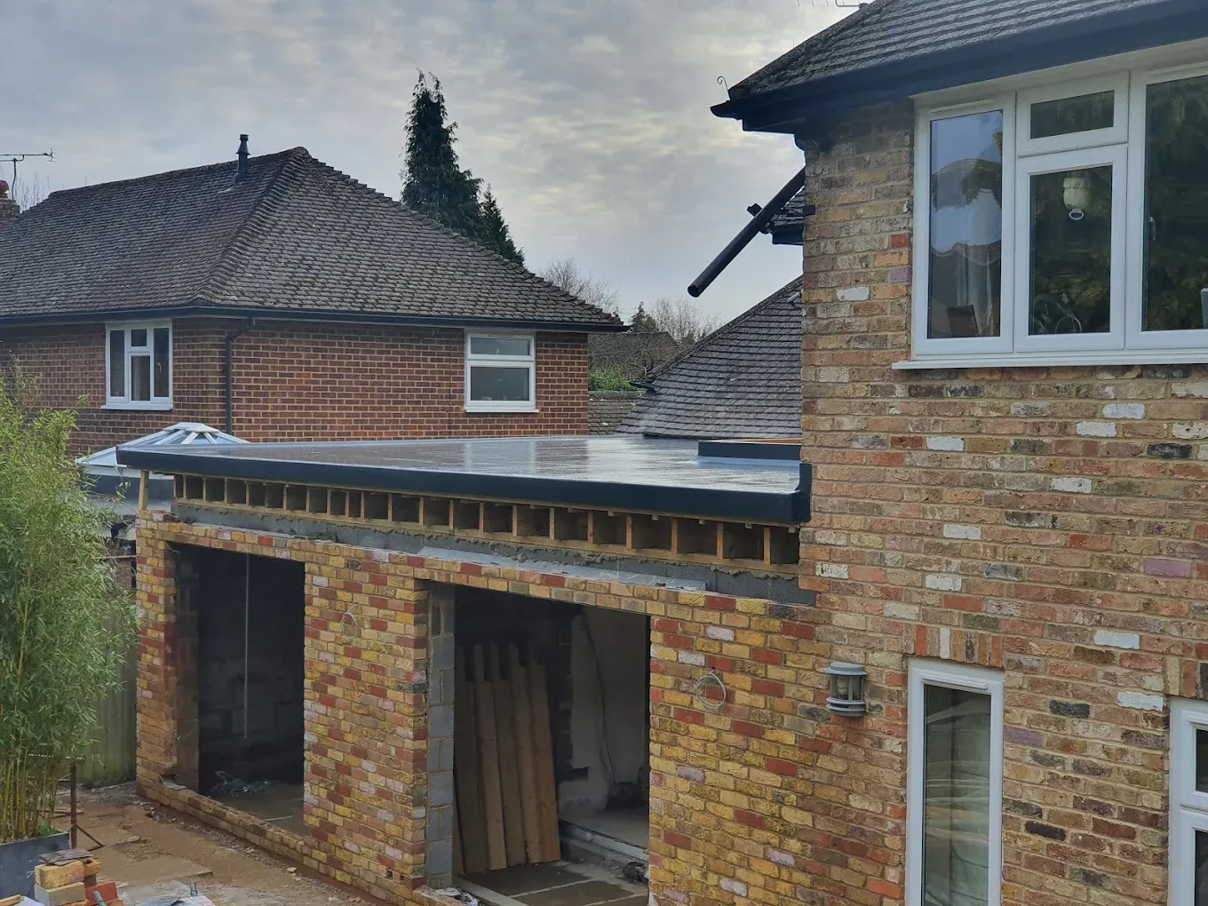 New flat roof installation on a house extension