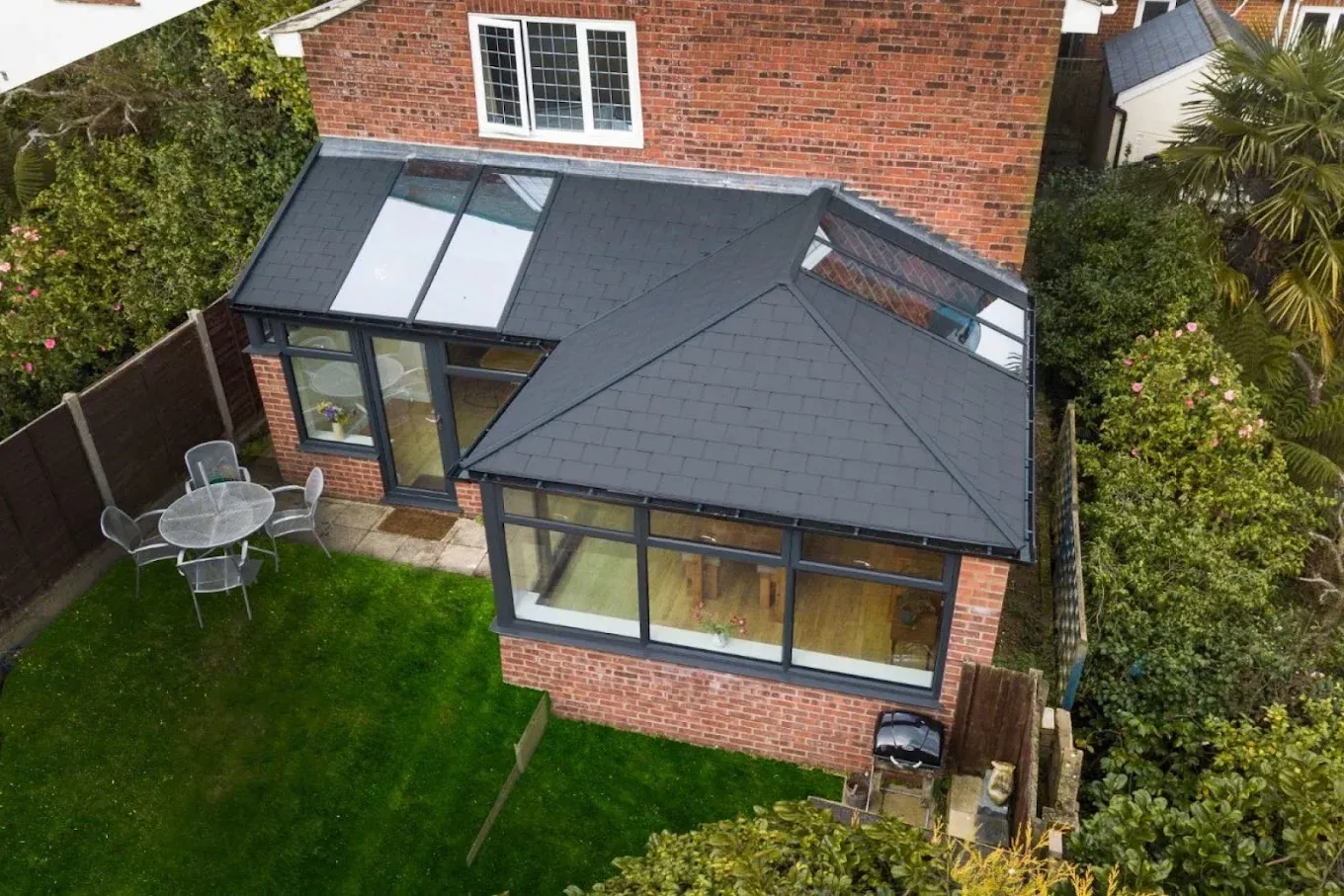 Conservatory with new tiled warm roof and glass panels