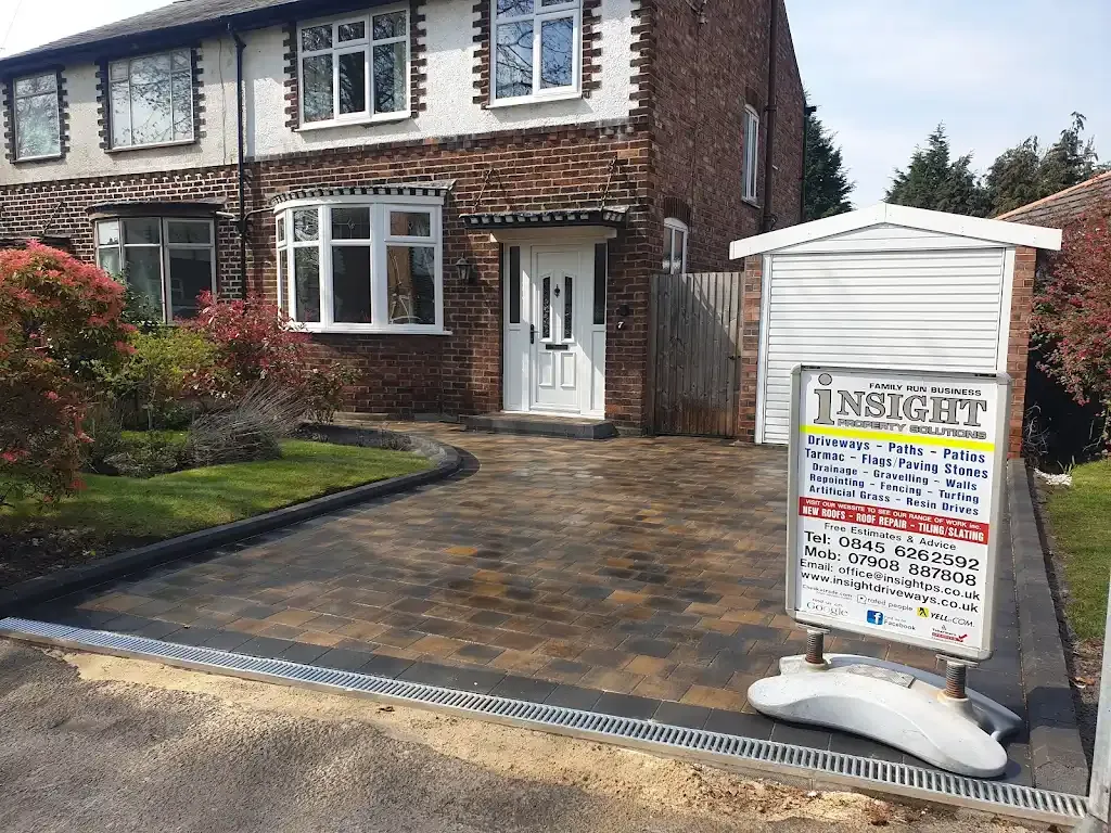 Newly installed block paved driveway and landscaping in front of a house by Insight PS