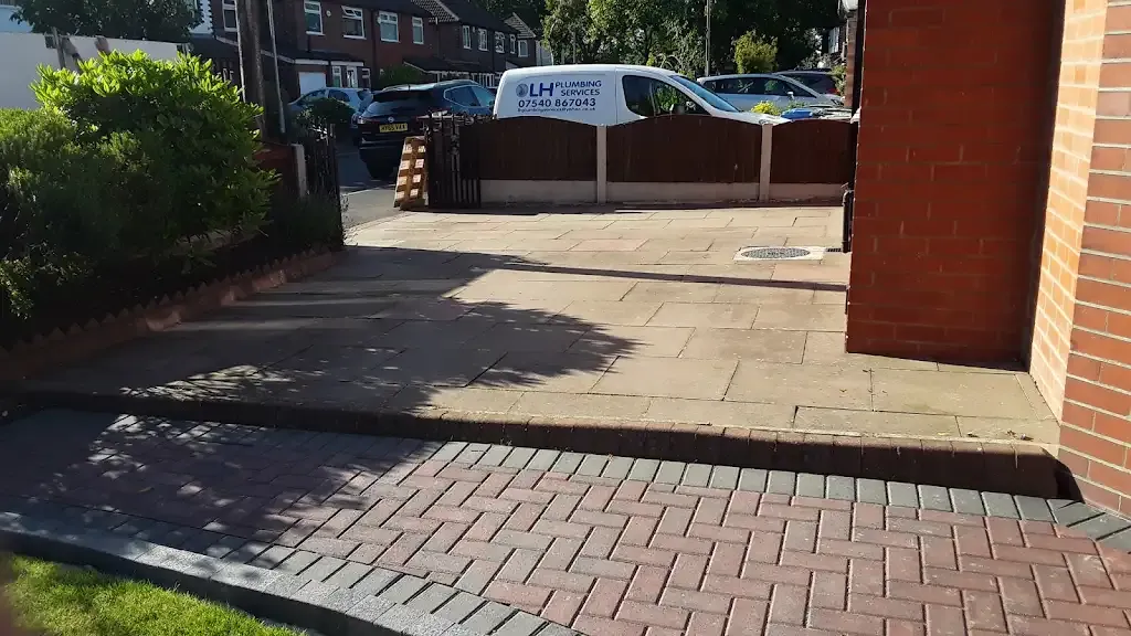 Residential driveway with block paving and paving slabs