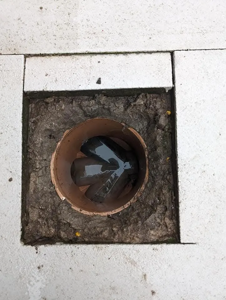 Blocked outdoor drain with standing water