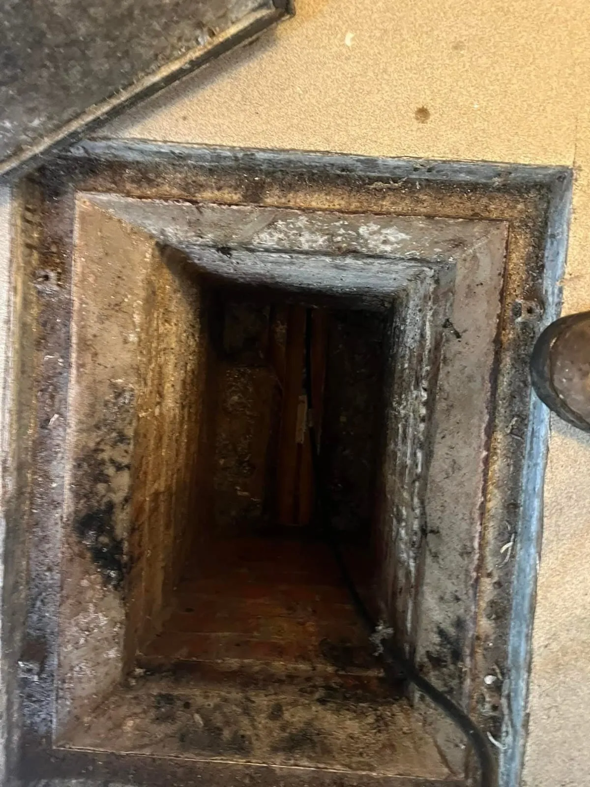 Open drain inspection chamber access point.