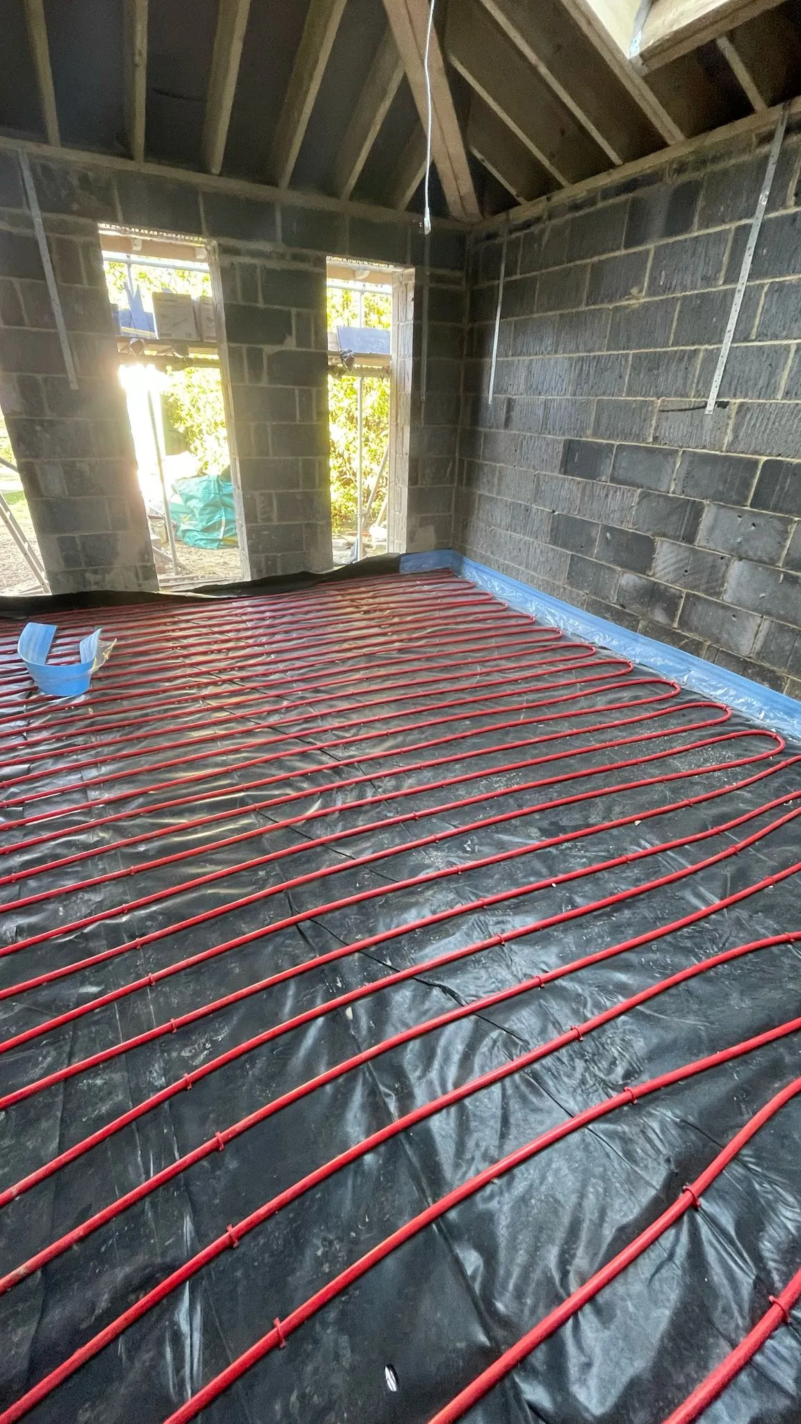 Underfloor heating installation during a home extension project by DP Carpentry and Building LTD in Cheltenham.
