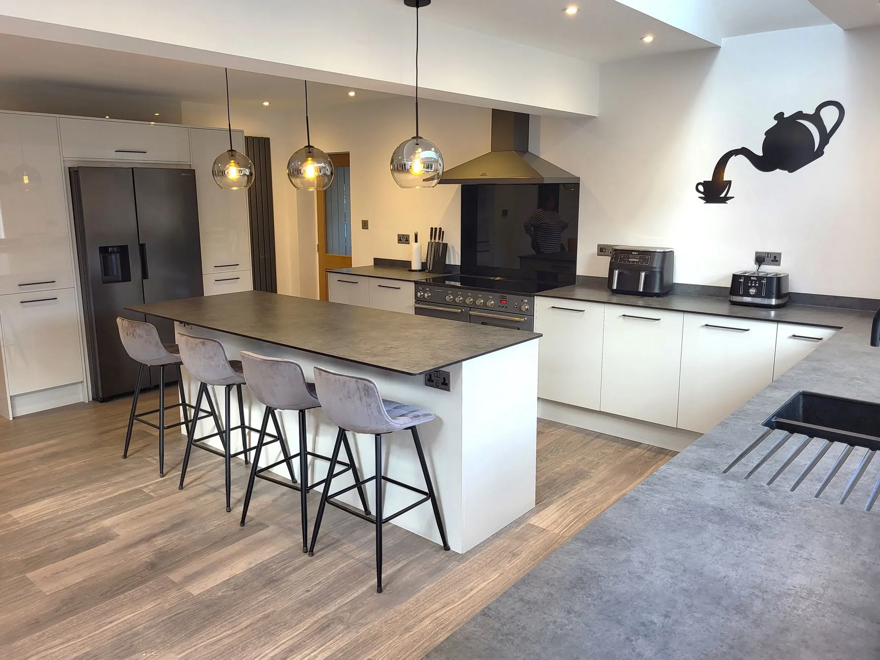 Bespoke kitchen installation in Hatherley, Gloucestershire by DP Carpentry & Building LTD, showcasing modern design with island.