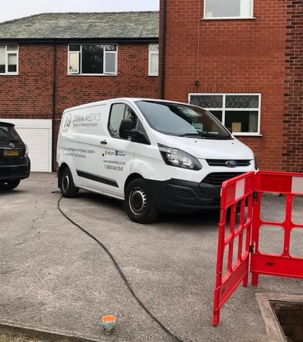 Drain Medics service van and equipment set up for drainage work at a residential property.