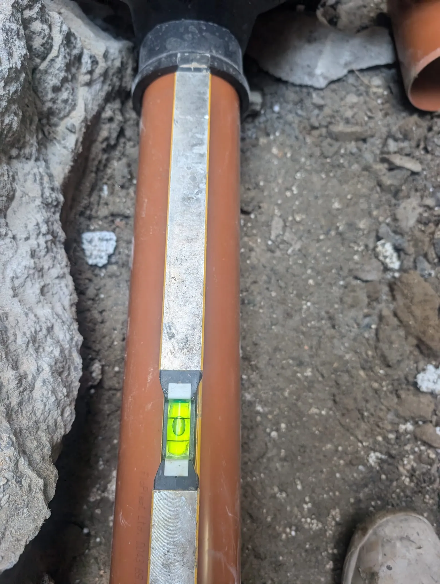 Installing a new drainage pipe.