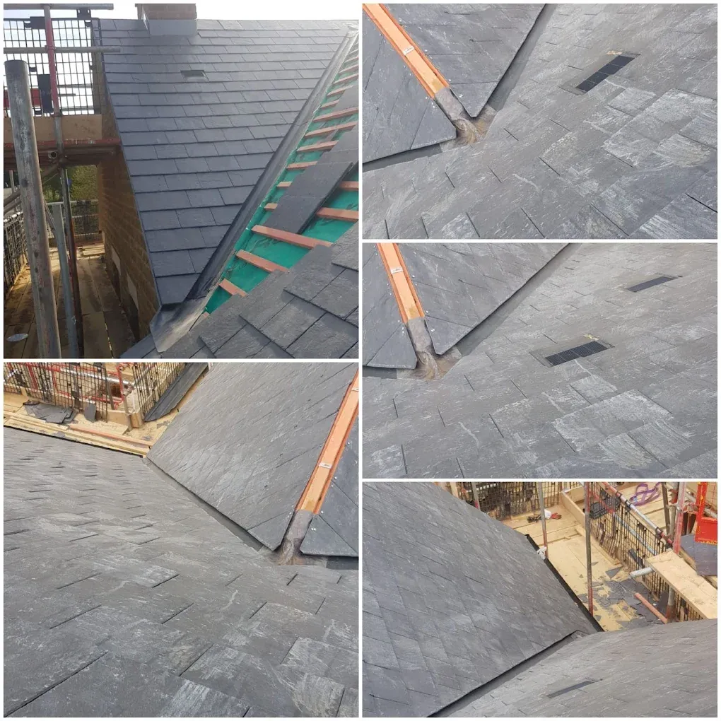 Professional slate roof installation in progress, showing valleys and roof vents