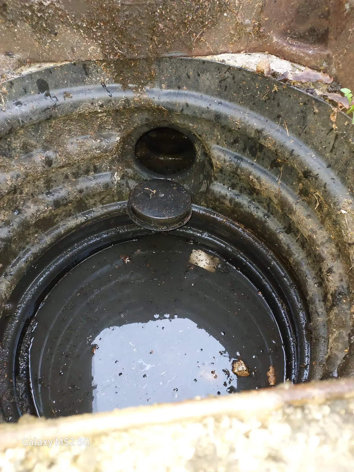 Blocked outdoor drain with standing dirty water