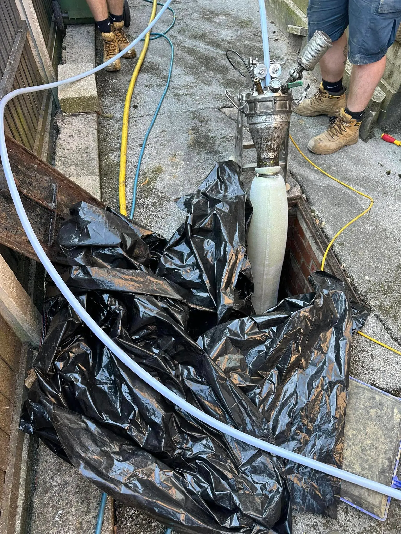 No-dig drain relining in progress by Drain 2 Flow Devon, showing advanced equipment for pipe repair.